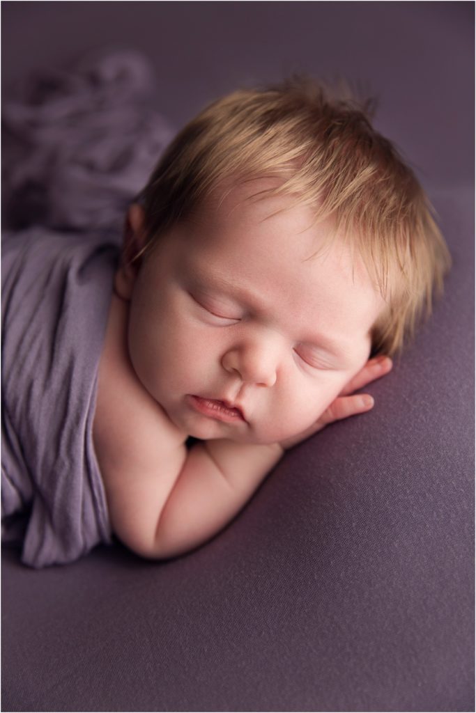 Blonde Haired Baby on Purple Backdrop