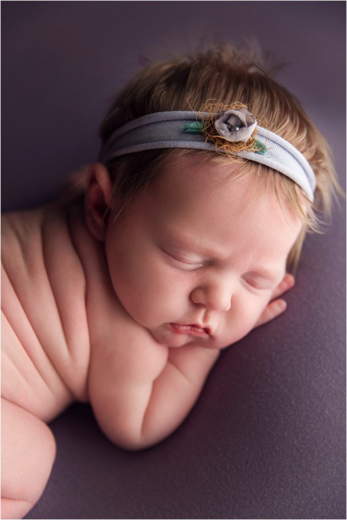 Blonde Haired Baby on Purple Backdrop